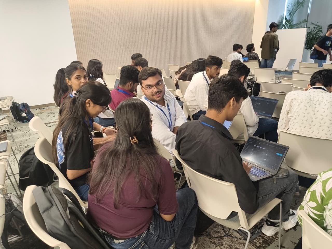 Teams building on laptops during the eight-hour Cognitive Chaos hackathon at the Microsoft India (R&D) office.